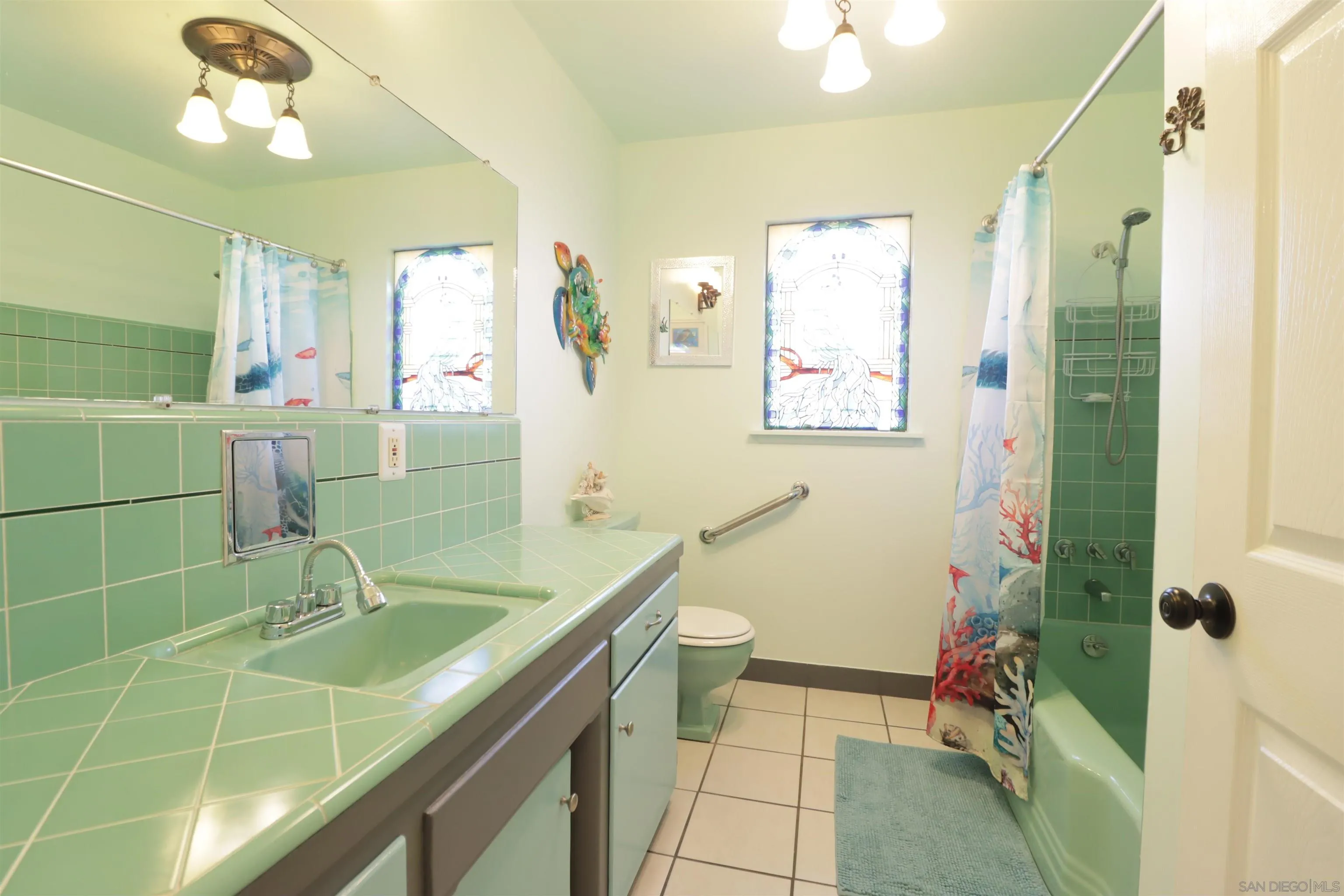 1233 Cresthill Road El Cajon, CA 92021 - Photo 38 of 50 a bathroom with a sink a toilet and shower