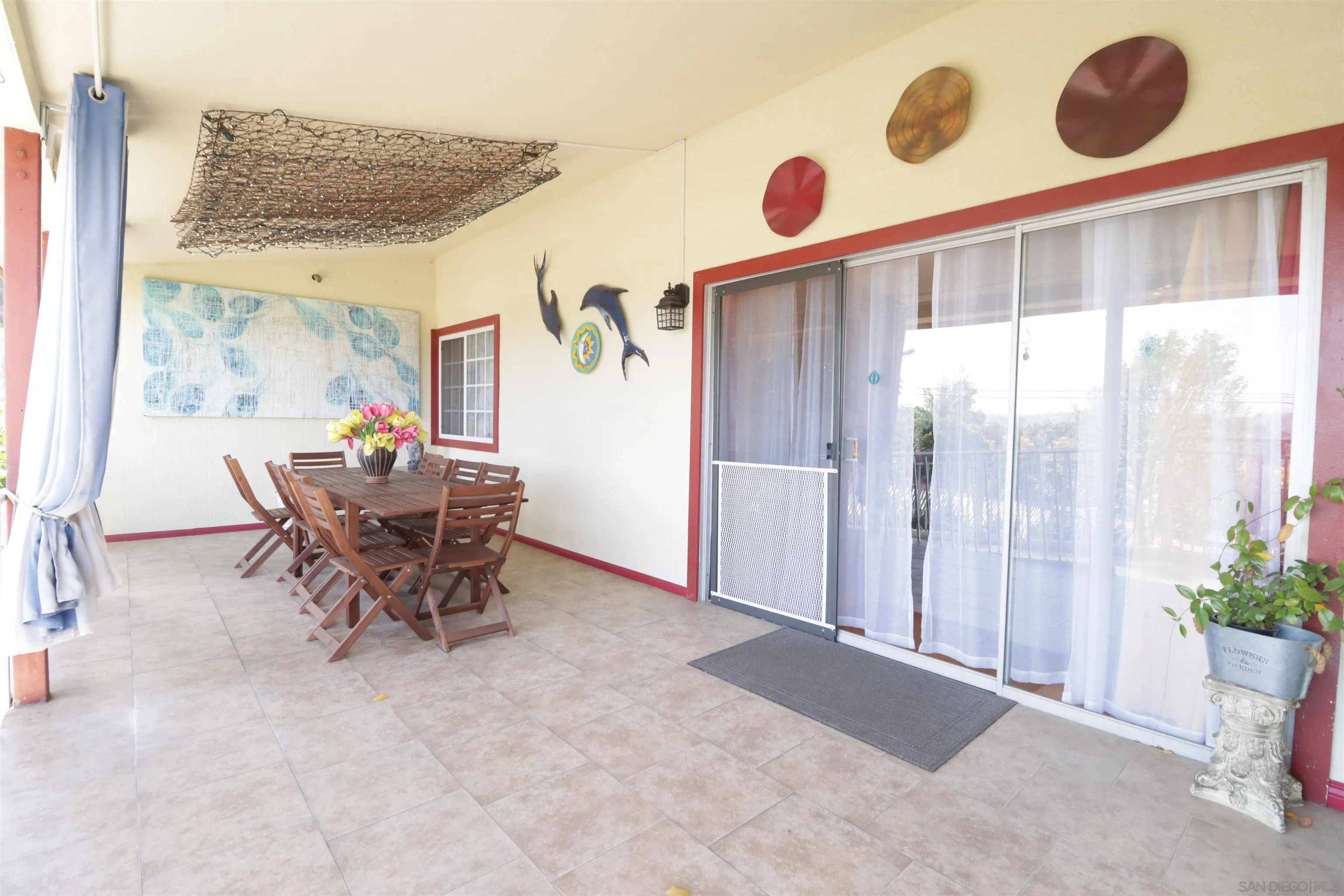 1233 Cresthill Road El Cajon, CA 92021 - Photo 39 of 50 a dining room with furniture and a large window