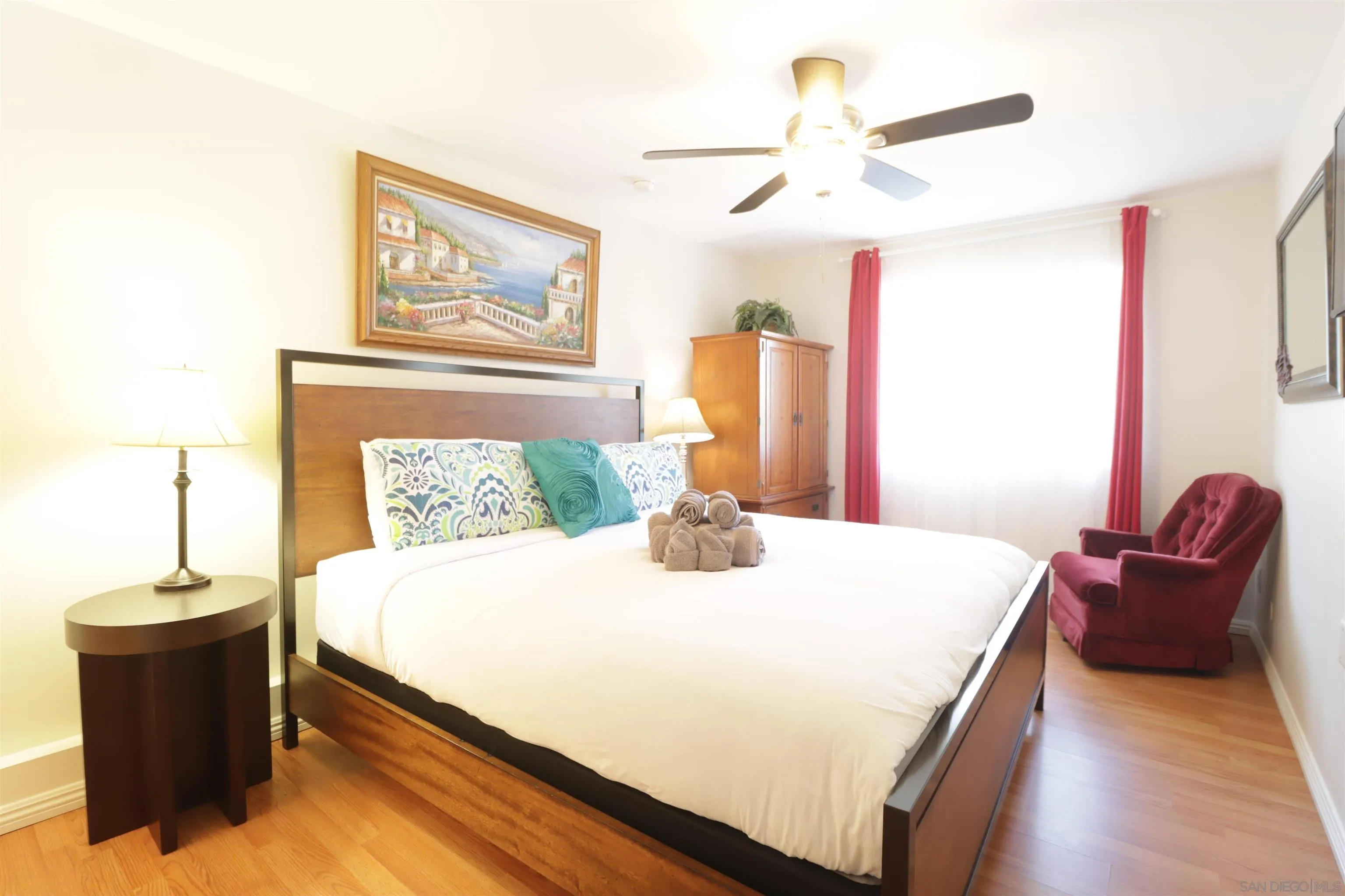 1233 Cresthill Road El Cajon, CA 92021 - Photo 7 of 50 a bedroom with a large bed and a chandelier