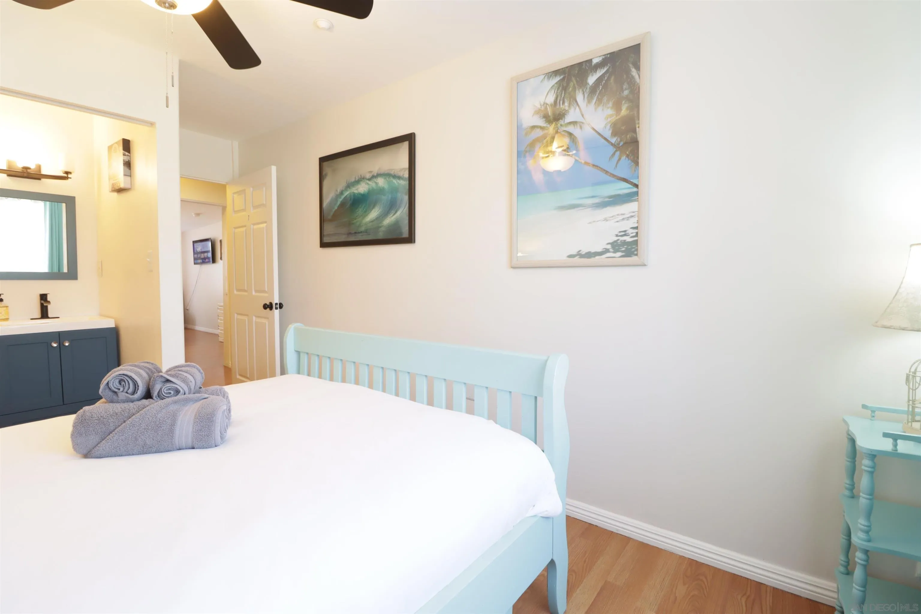 1233 Cresthill Road El Cajon, CA 92021 - Photo 10 of 50 a bedroom with a large bed and a chandelier