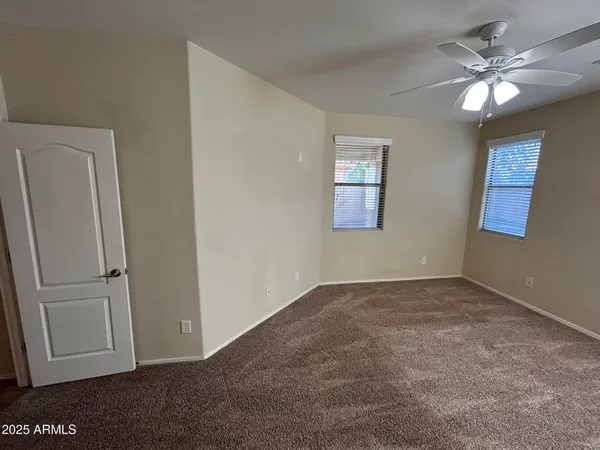 a bathroom with a tub a double vanity sink and a mirror