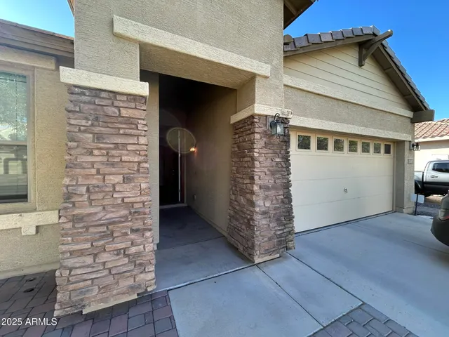 a view of entryway with a brick wall