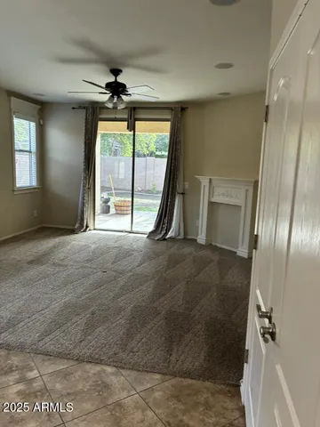 a kitchen with kitchen island granite countertop a sink dishwasher stove and cabinets with wooden floor