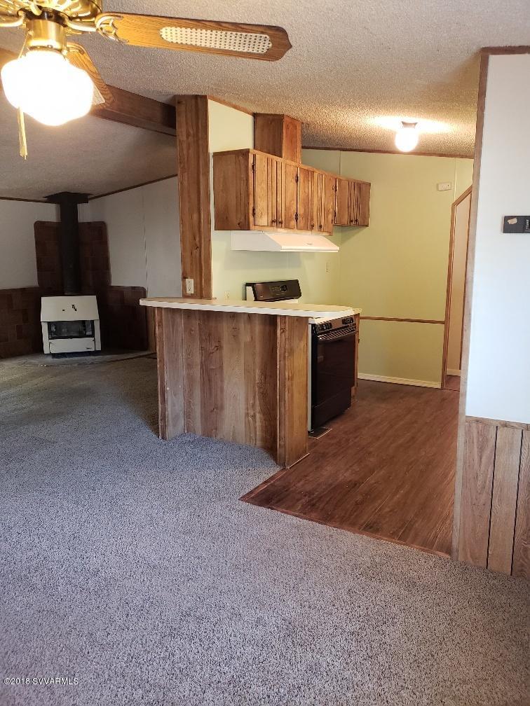 4330 East Waldron Road Rimrock, AZ 86335 - Photo 11 of 43 a view of kitchen with furniture and wooden floor