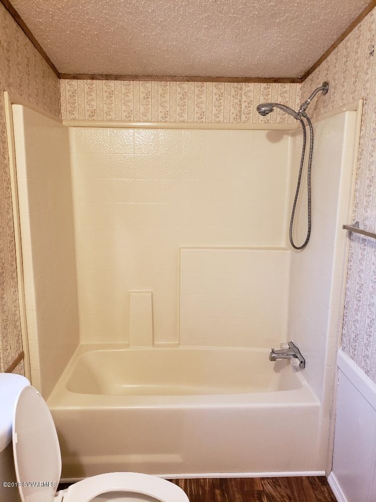 4330 East Waldron Road Rimrock, AZ 86335 - Photo 33 of 43 a bathroom with a shower and a bath tub