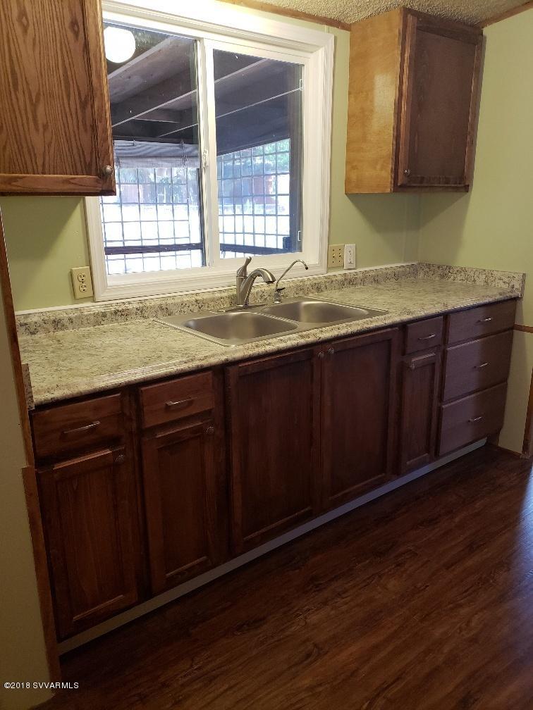4330 East Waldron Road Rimrock, AZ 86335 - Photo 8 of 43 a bathroom with a granite countertop sink and window