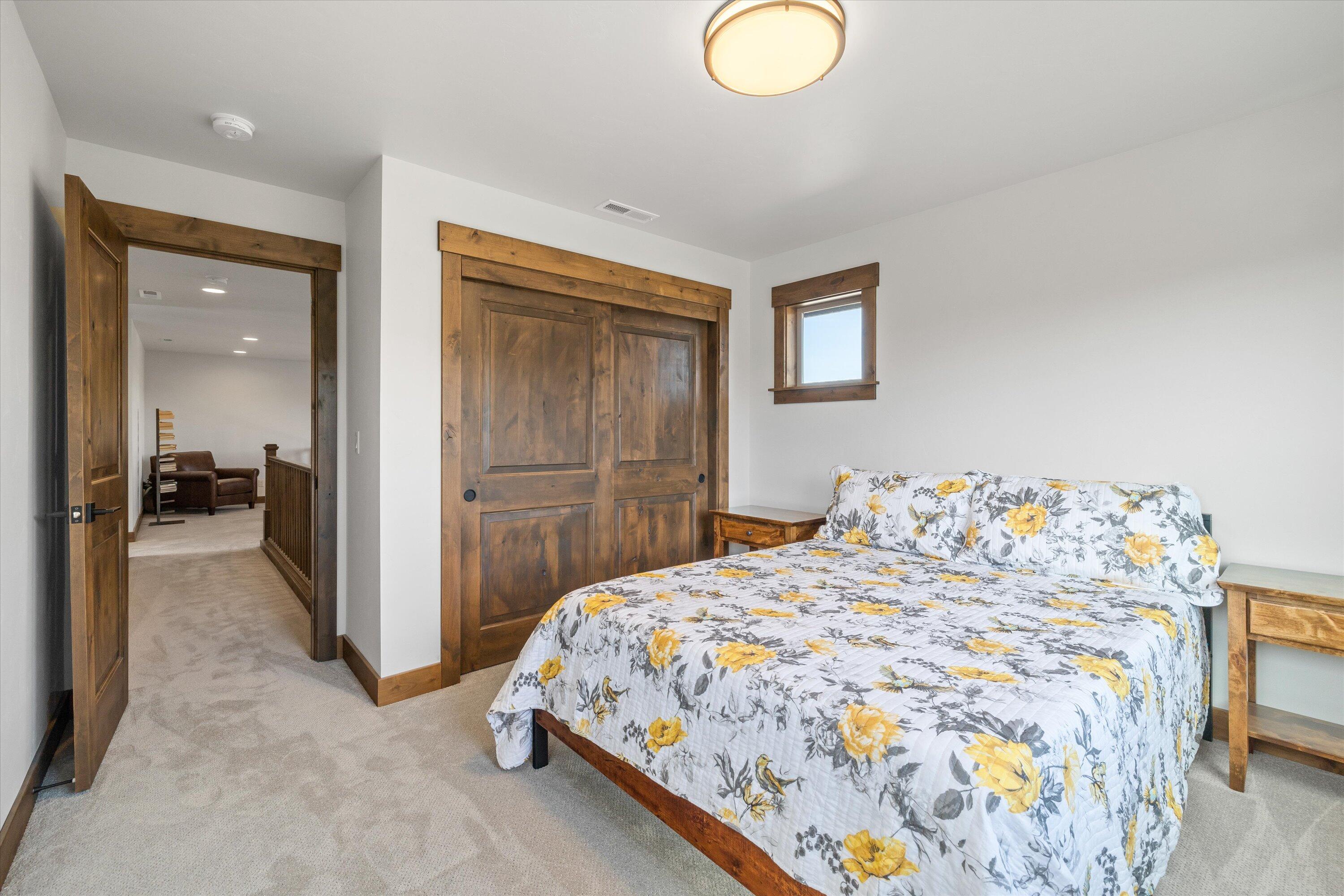 15687 Southwest Brasada Rnch Road Powell Butte, OR 97753 - Photo 47 of 73 a bedroom with a bed and a mirror
