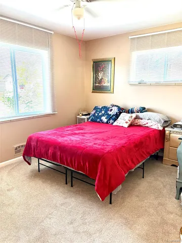 a bed room with a bed and a dresser