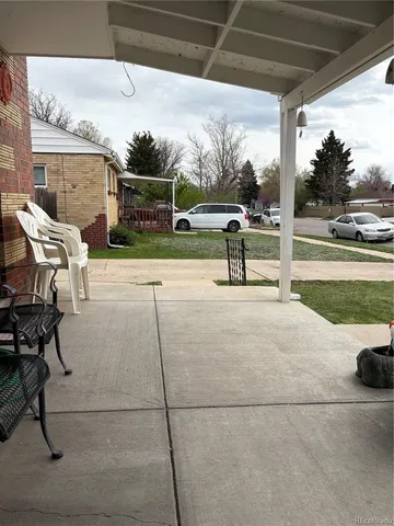 a view of a backyard with wooden fence