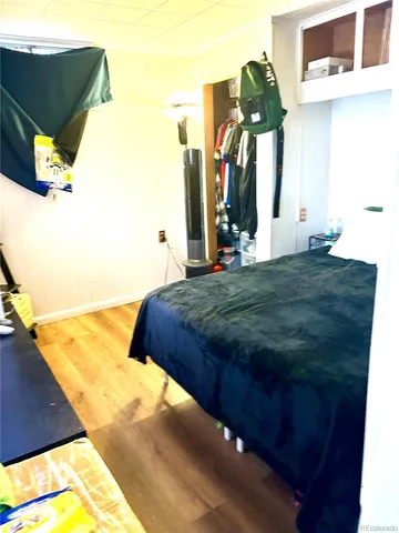 a bedroom with a bed and a flat tv screen