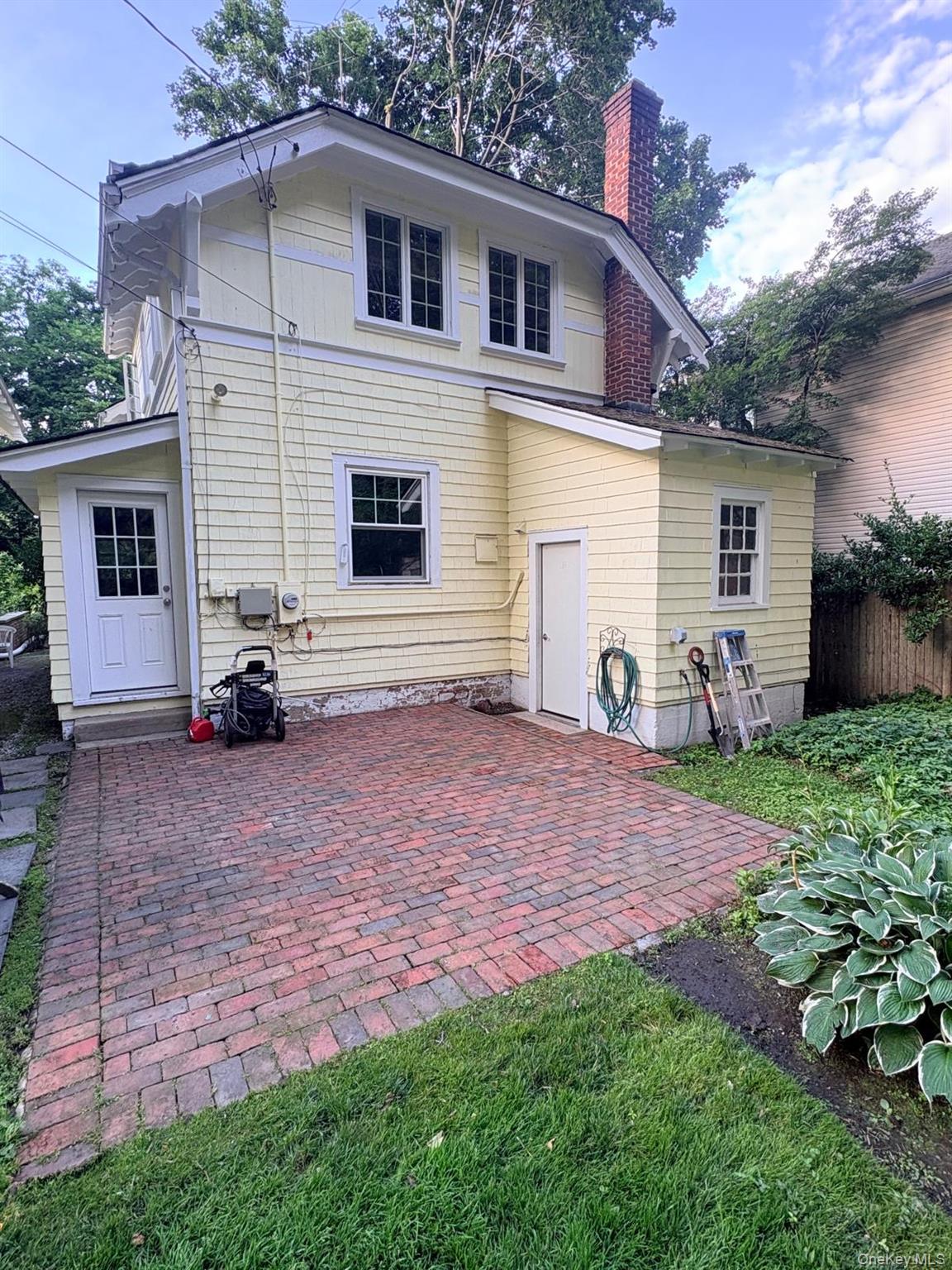6 Tower Road Glen Cove, NY 11542 - Photo 12 of 12 a view of a house with backyard and a tree