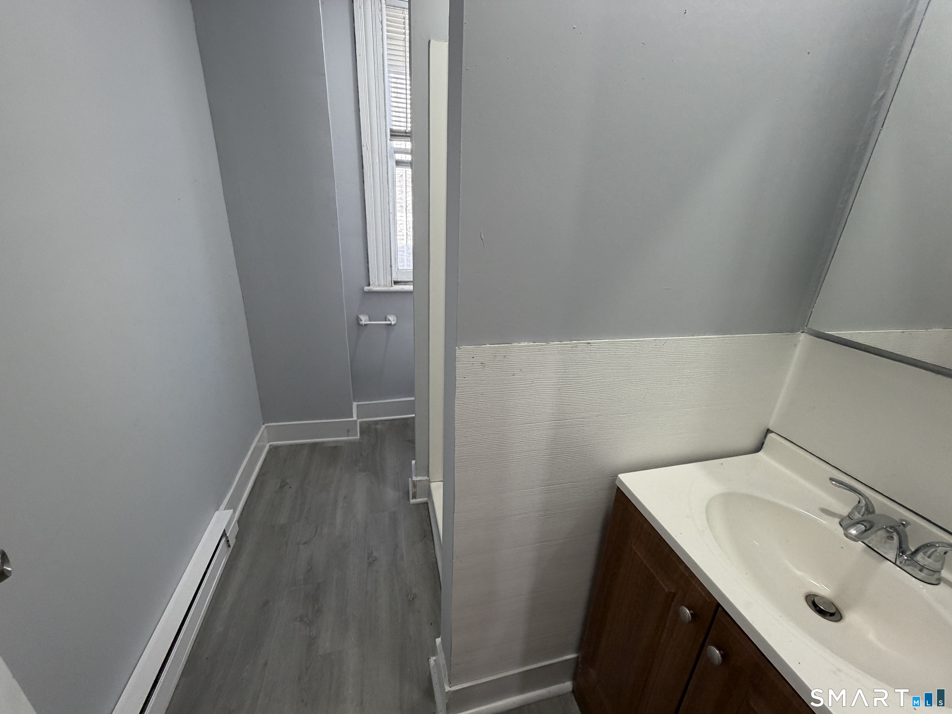 73 Waterville Street, Unit 3 Waterbury, CT 06710 - Photo 2 of 9 a bathroom with a sink and mirror