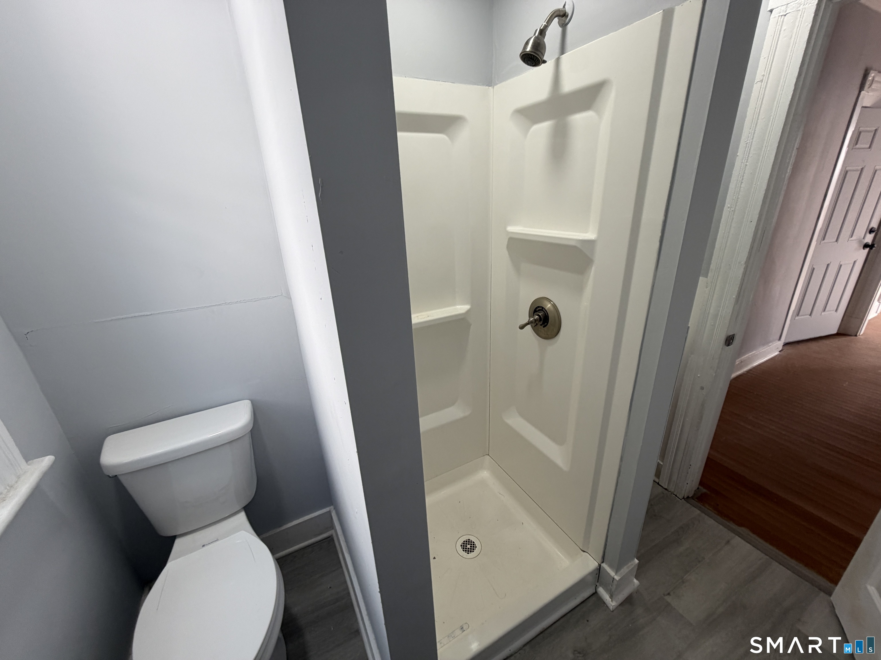 73 Waterville Street, Unit 3 Waterbury, CT 06710 - Photo 3 of 9 a bathroom with a toilet and a shower