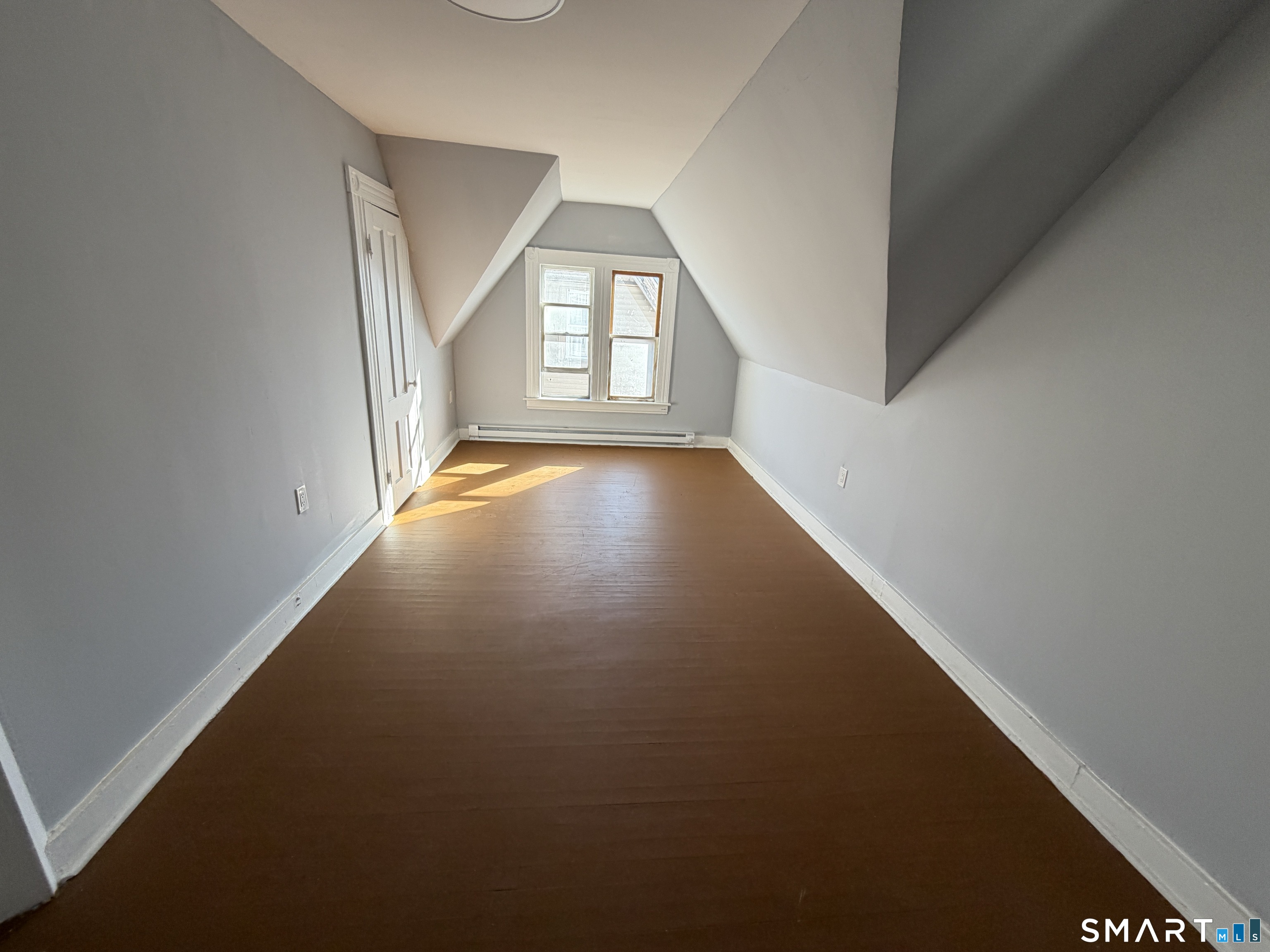 73 Waterville Street, Unit 3 Waterbury, CT 06710 - Photo 4 of 9 an empty room with windows
