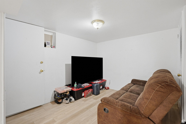 707 East 150 South Provo, UT 84606 - Photo 20 of 31 Light-colored wood-look flooring with a flush-mounted ceiling light fixture