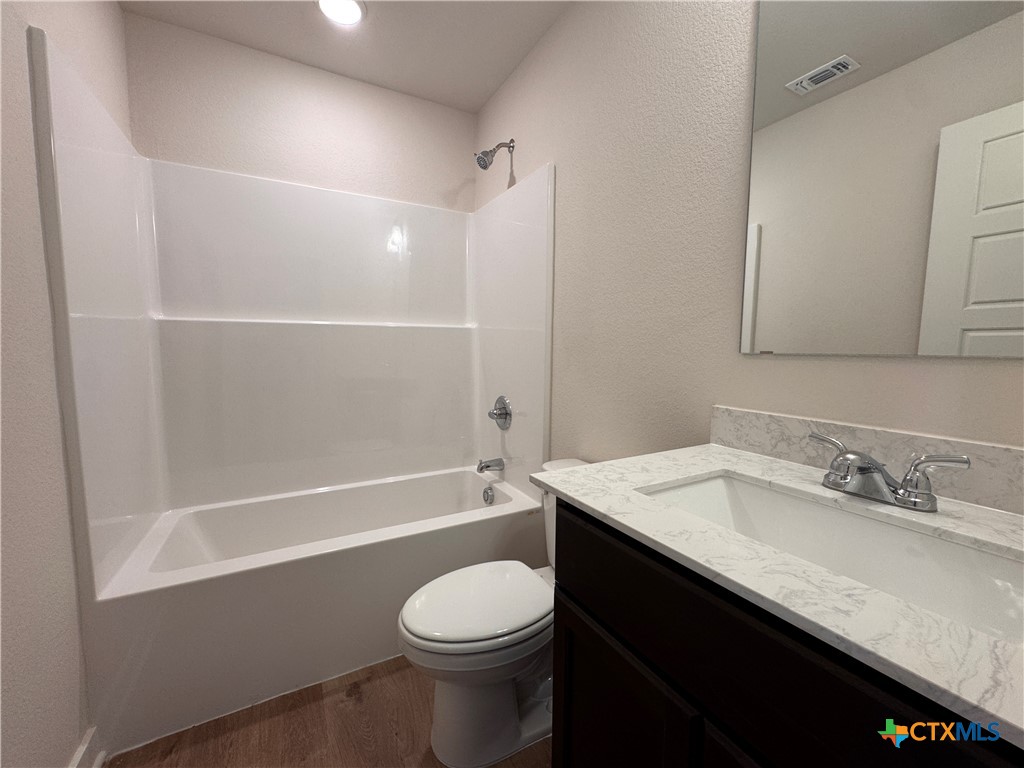 310 University Avenue Troy, TX 76579 - Photo 14 of 21 a bathroom with a sink a toilet and shower