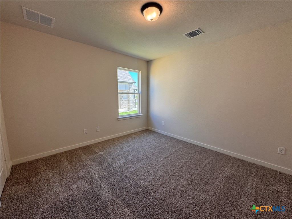 310 University Avenue Troy, TX 76579 - Photo 15 of 21 an empty room with windows