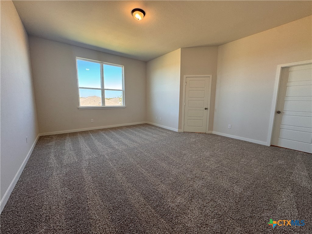 310 University Avenue Troy, TX 76579 - Photo 17 of 21 an empty room with a empty space and windows