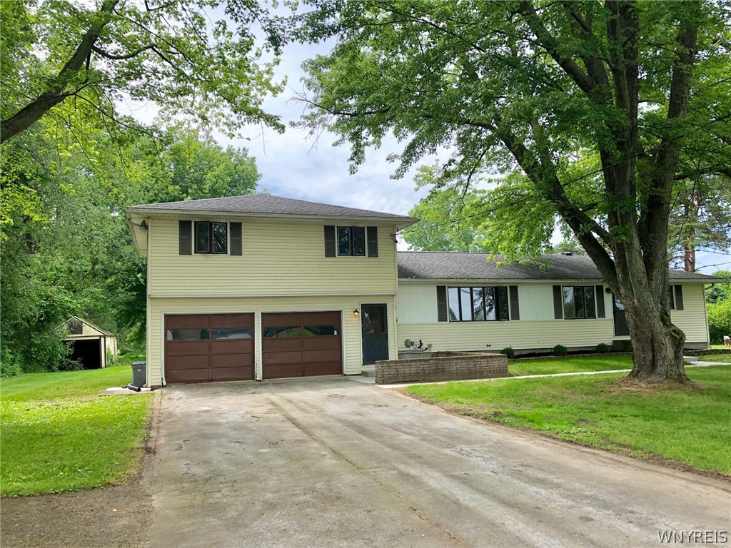 7392 Maple Road Newstead, NY 14001 - Photo 1 of 1 1.7 ACRES SURROUND THIS SPACIOUS SPLIT LEVEL WITH