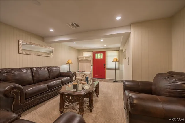 a living room with furniture and a table