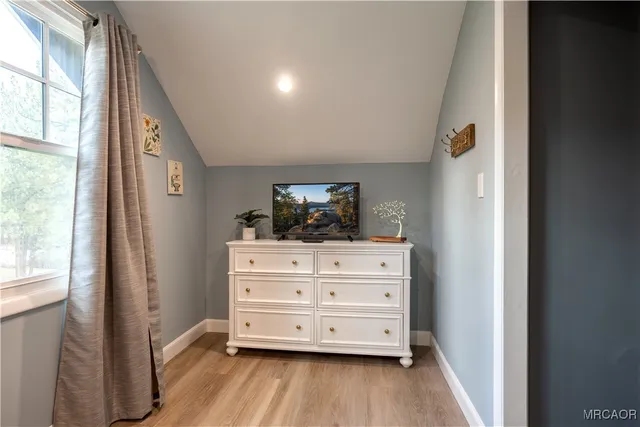 a view of dresser and window