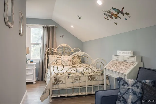 a view of a room with furniture and a chandelier