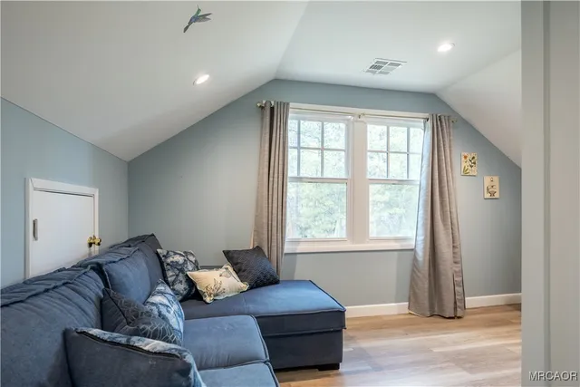 a living room with furniture and a window