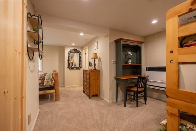 a livingroom with furniture and a flat screen tv