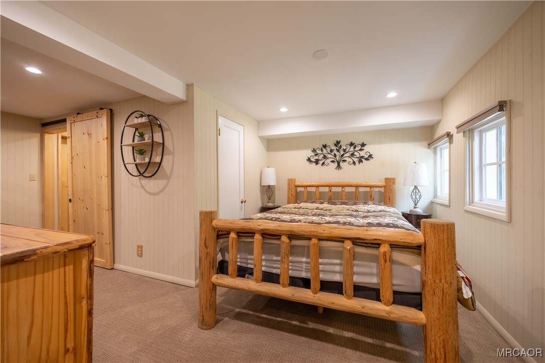 195 Elgin Road Big Bear Lake, CA 92315 - Photo 31 of 40 a bedroom with a bed and a window