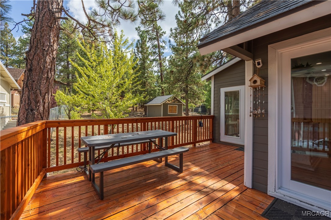 195 Elgin Road Big Bear Lake, CA 92315 - Photo 33 of 40 a view of a wooden deck with a bench