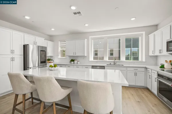 a bedroom with a bed and a potted plant