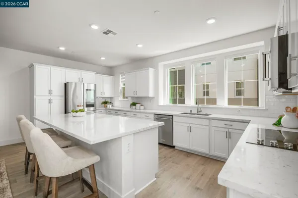a spacious bathroom with a double vanity sink mirror and double