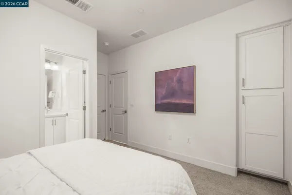 a view of a dining room with furniture and a potted plant