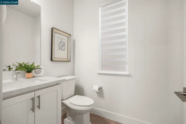 a living room with furniture and a glass door