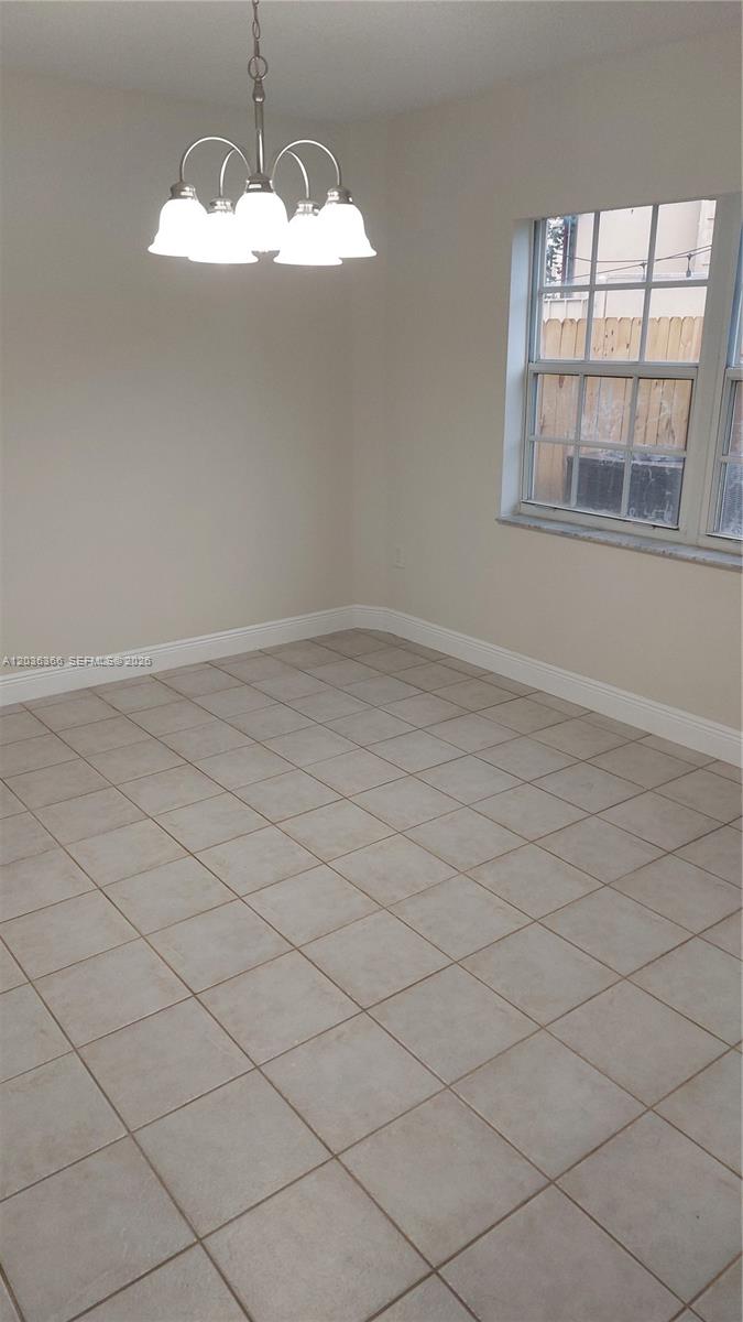 7083 Southwest 158th Court Miami, FL 33193 - Photo 10 of 22 a view of empty room with a large window