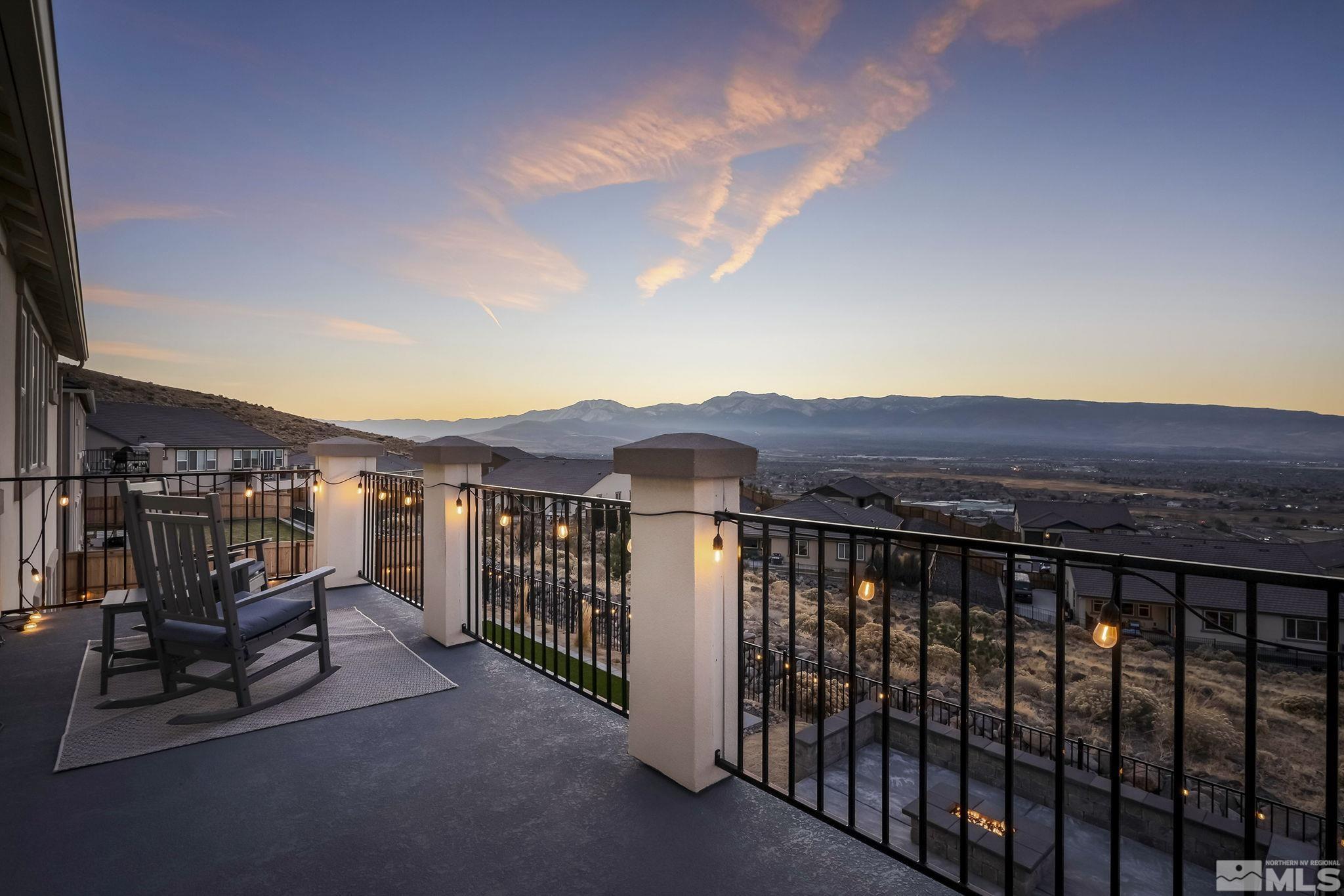 a view of a balcony with an outdoor seating