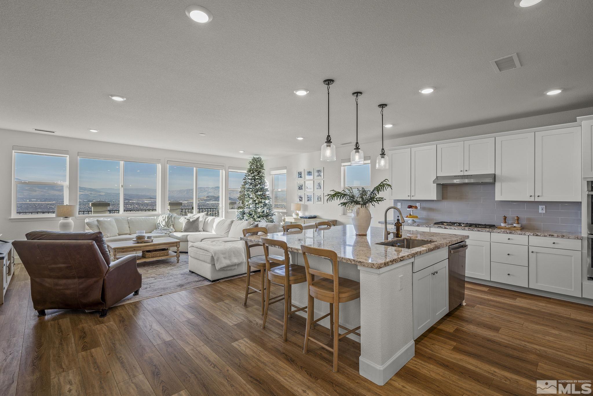 10489 Claim Jumper Way Reno, NV 89521 - Photo 11 of 40 a living room with stainless steel appliances granite countertop furniture wooden floor and a view of kitchen