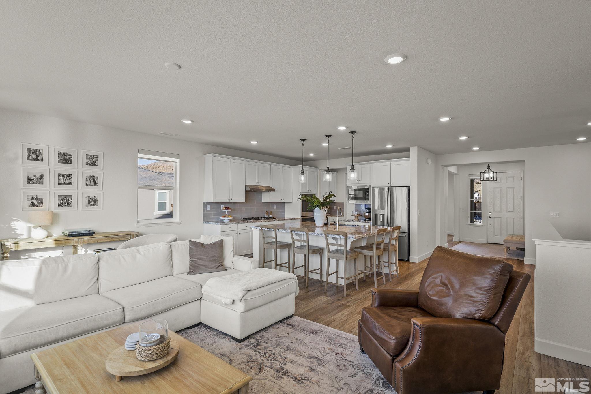10489 Claim Jumper Way Reno, NV 89521 - Photo 13 of 40 a living room with furniture kitchen view and a table