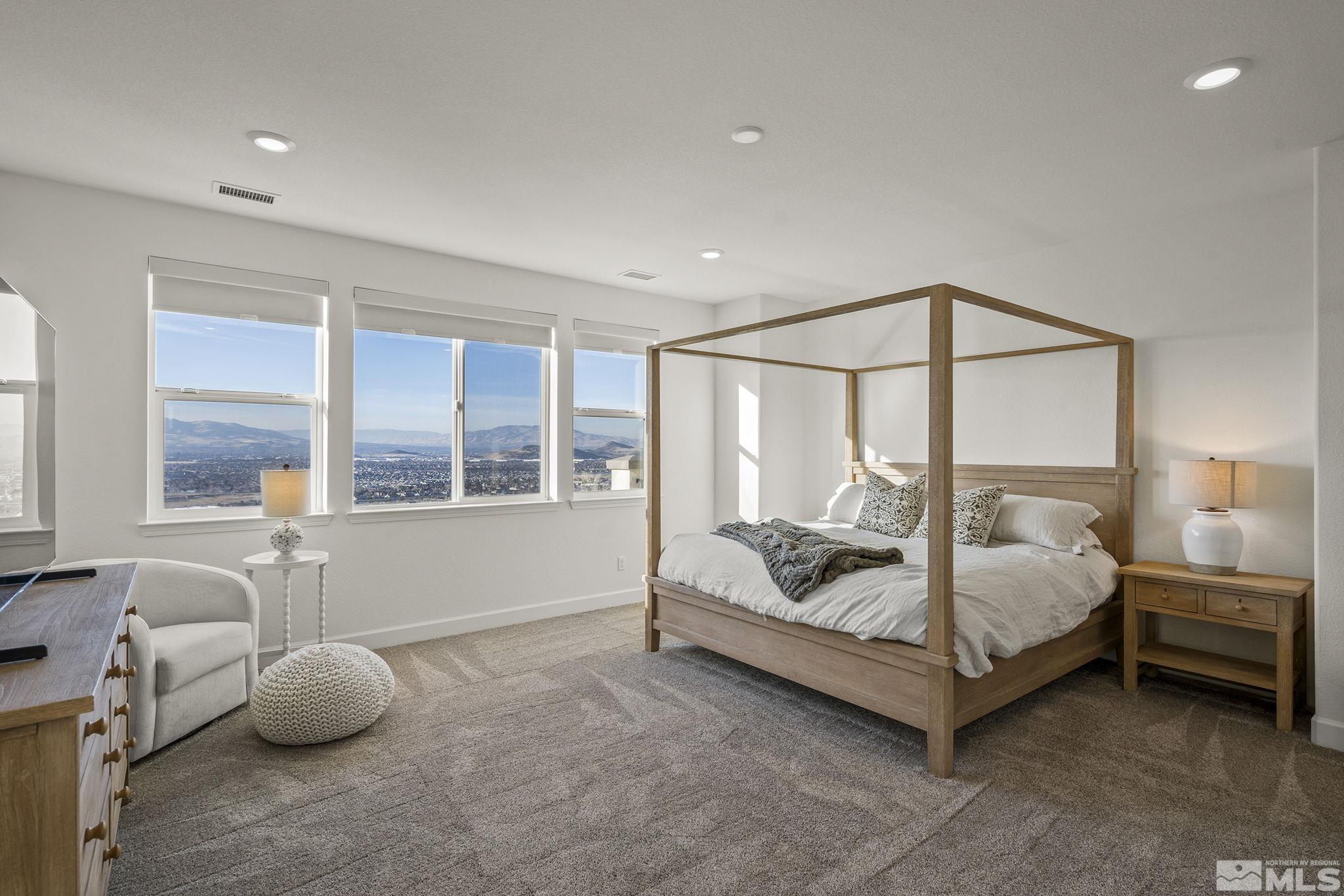 10489 Claim Jumper Way Reno, NV 89521 - Photo 19 of 40 a bedroom with furniture and a large window
