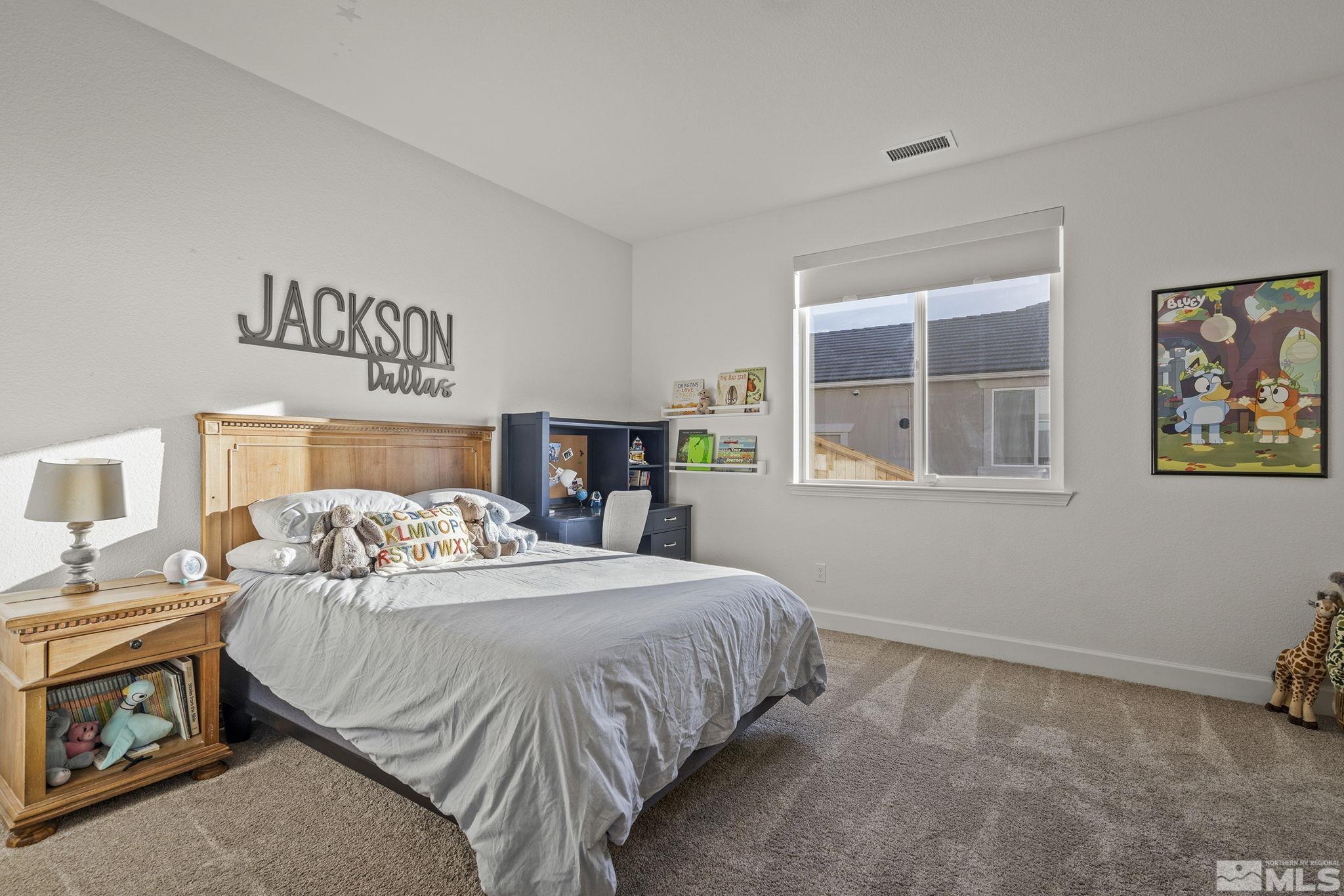 10489 Claim Jumper Way Reno, NV 89521 - Photo 22 of 40 a bedroom with a bed and a window