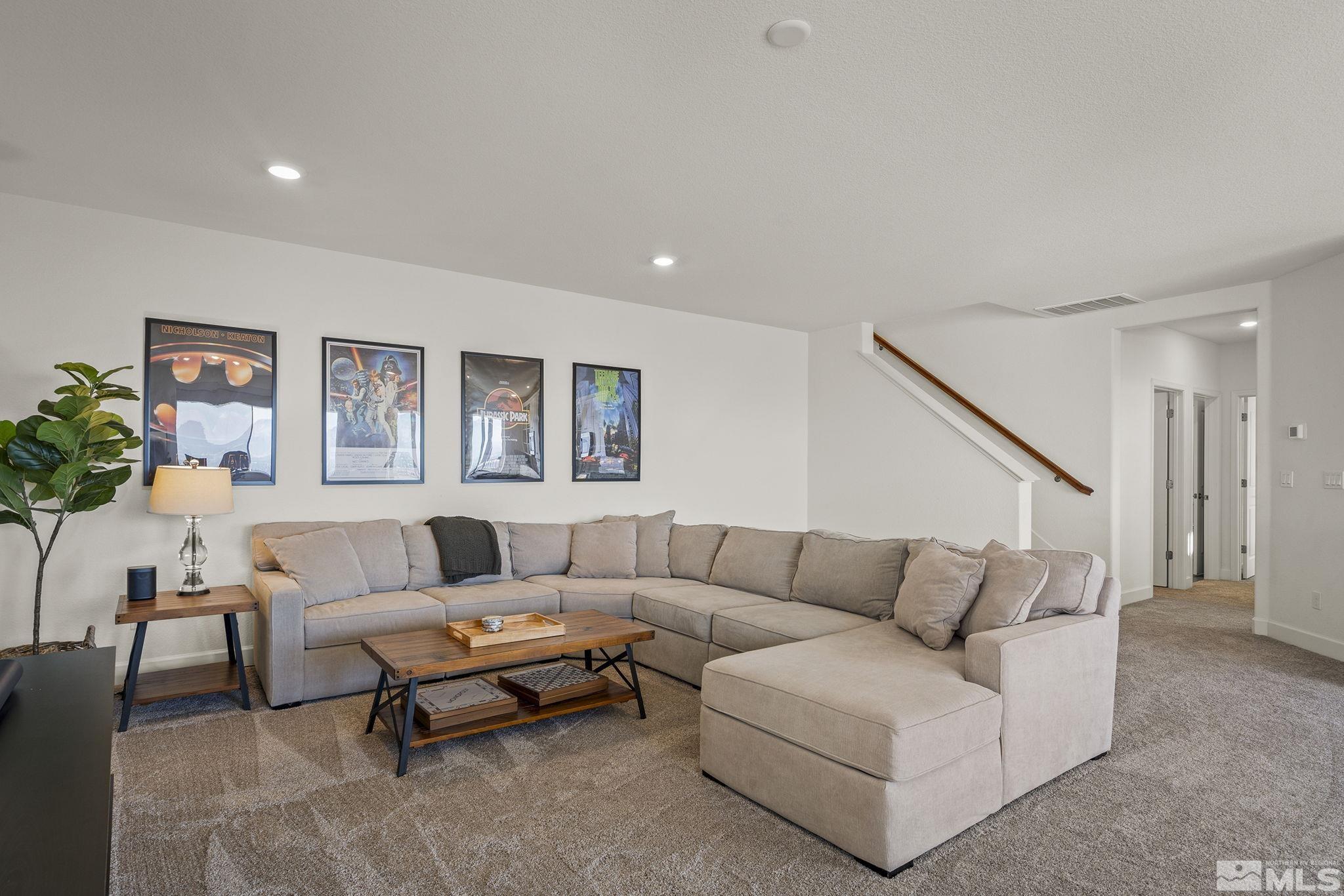 10489 Claim Jumper Way Reno, NV 89521 - Photo 27 of 40 a living room with furniture and a potted plant