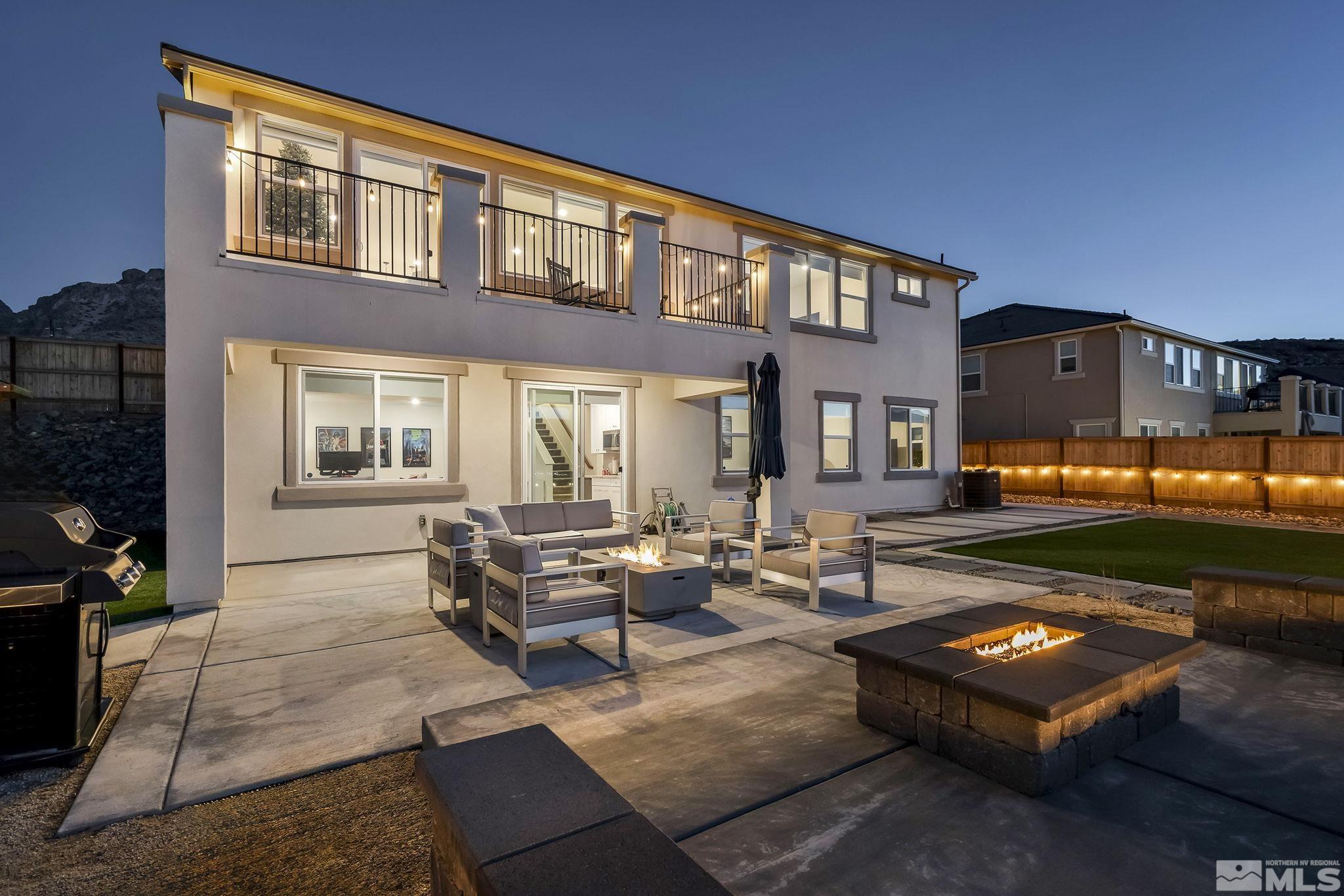 10489 Claim Jumper Way Reno, NV 89521 - Photo 7 of 40 a outdoor living space with furniture and a fireplace