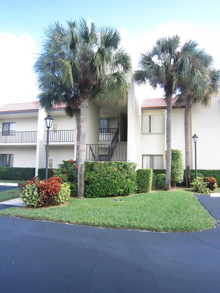 1605 Highway 1, Unit 201V2 Jupiter, FL 33477 - Photo 2 of 9 a front view of a house with garden