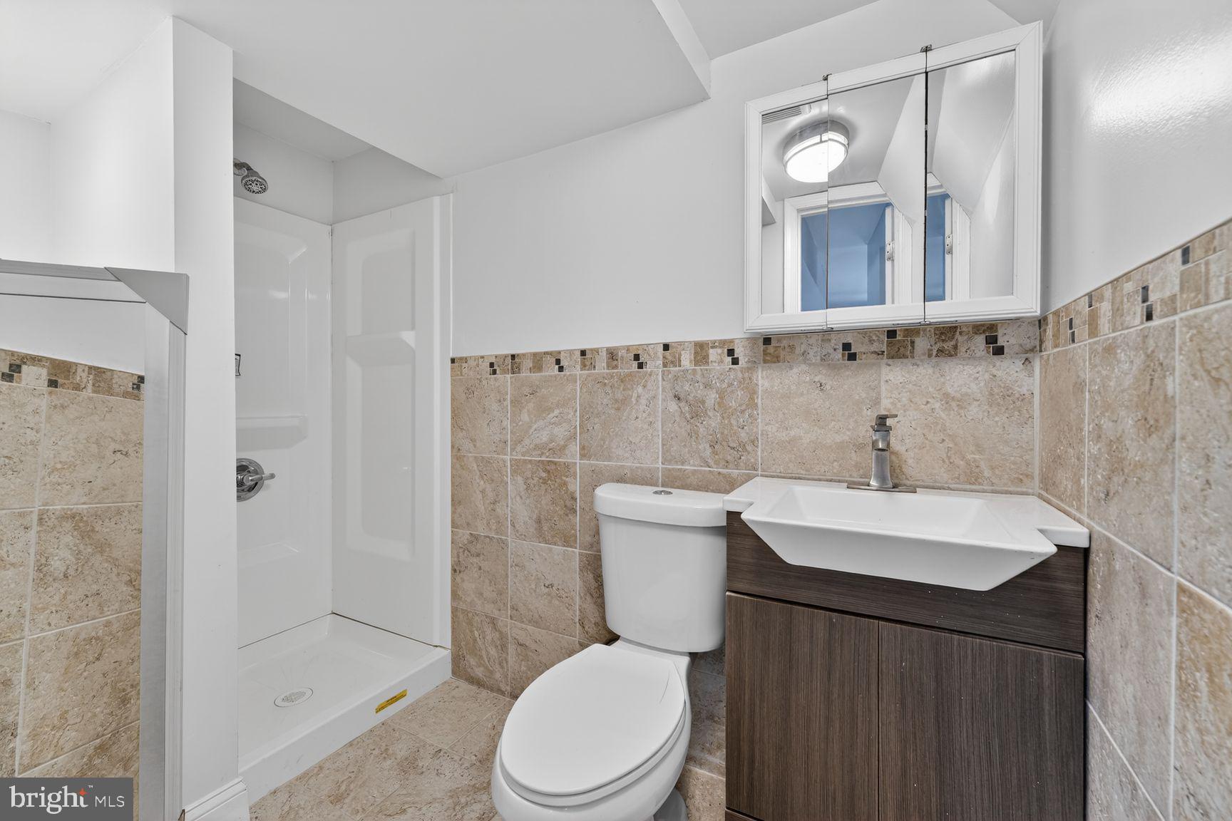 7205 Livingston Road Oxon Hill, MD 20745 - Photo 20 of 25 Modern bathroom with elegant tiles.