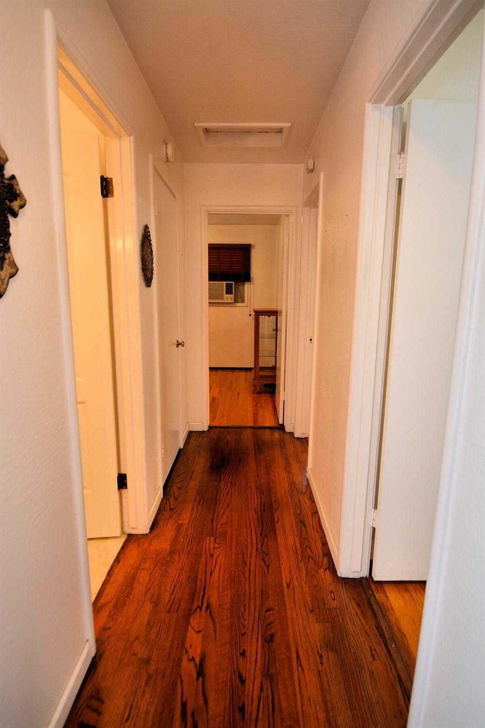 1306 Joni Avenue Modesto, CA 95350 - Photo 9 of 20 a view of a walk in closet with wooden floor