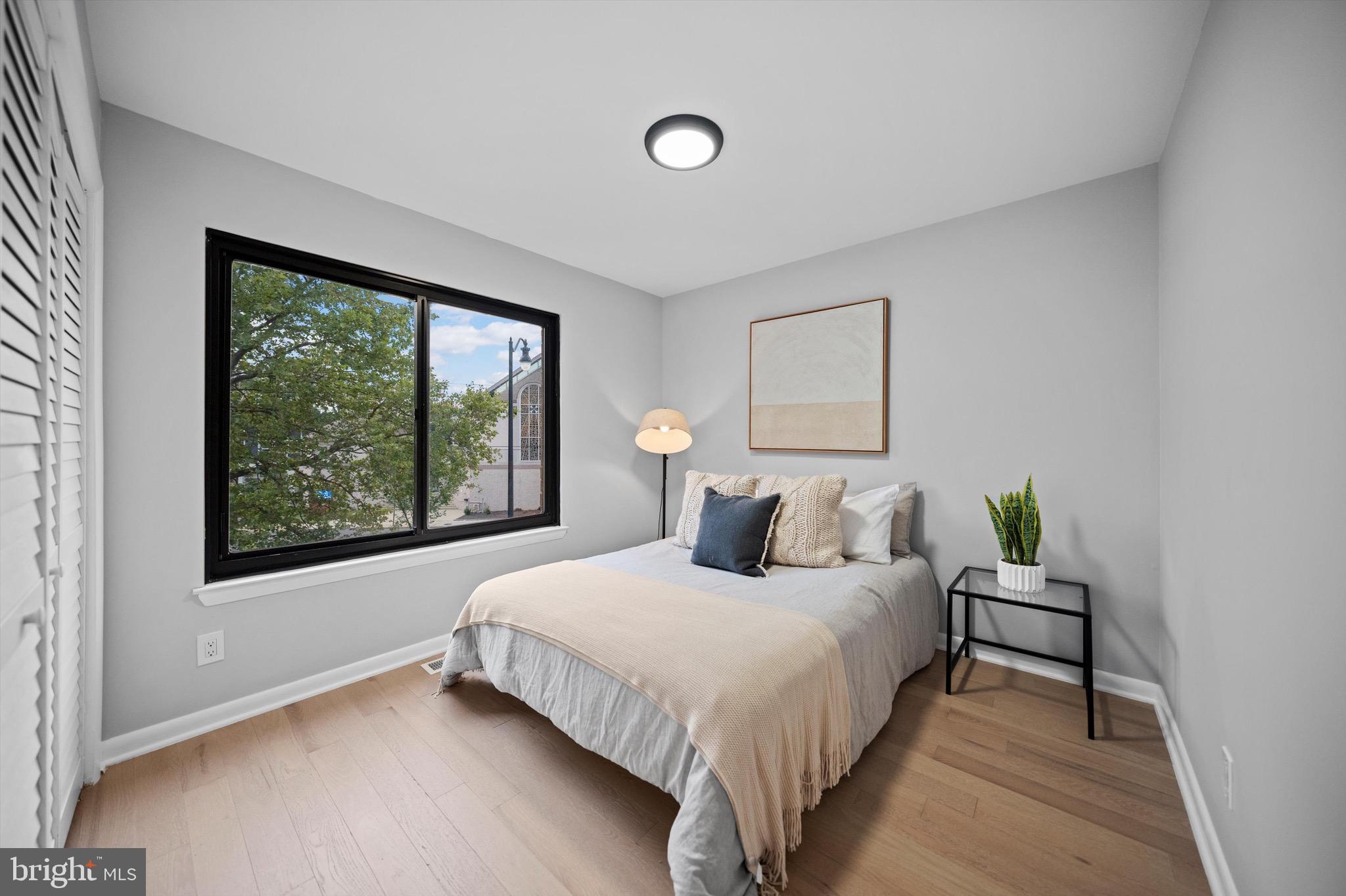 3114 Berry Road Northeast, Unit 21 Washington, DC 20018 - Photo 16 of 25 a bedroom with a bed and window