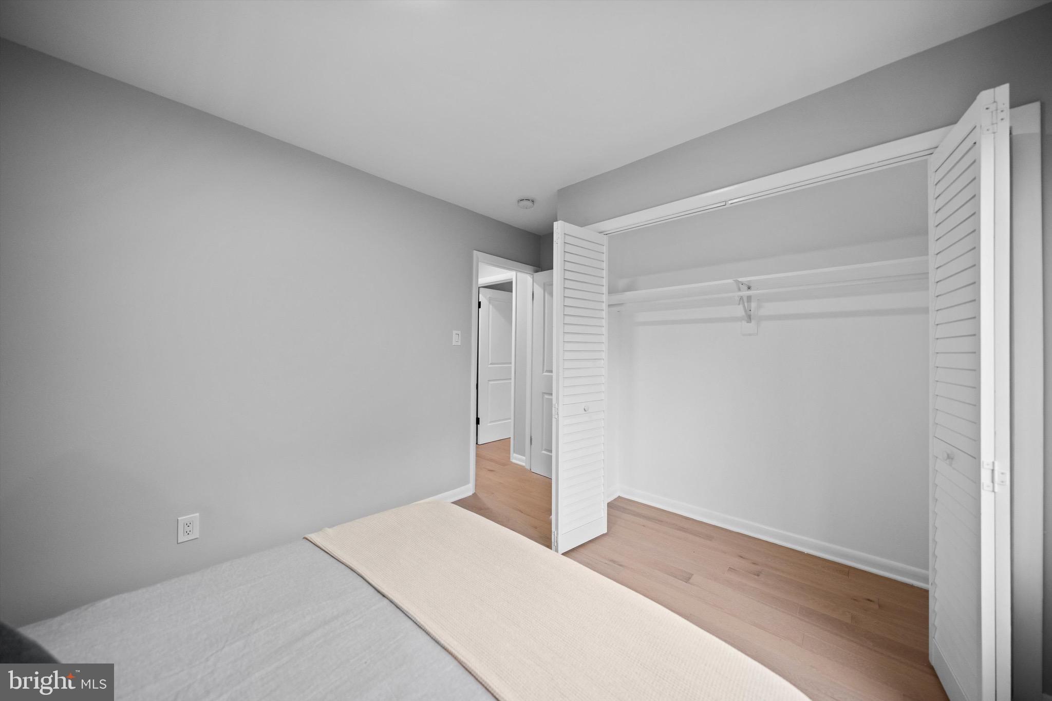 3114 Berry Road Northeast, Unit 21 Washington, DC 20018 - Photo 17 of 25 a bedroom with a bed and a shower