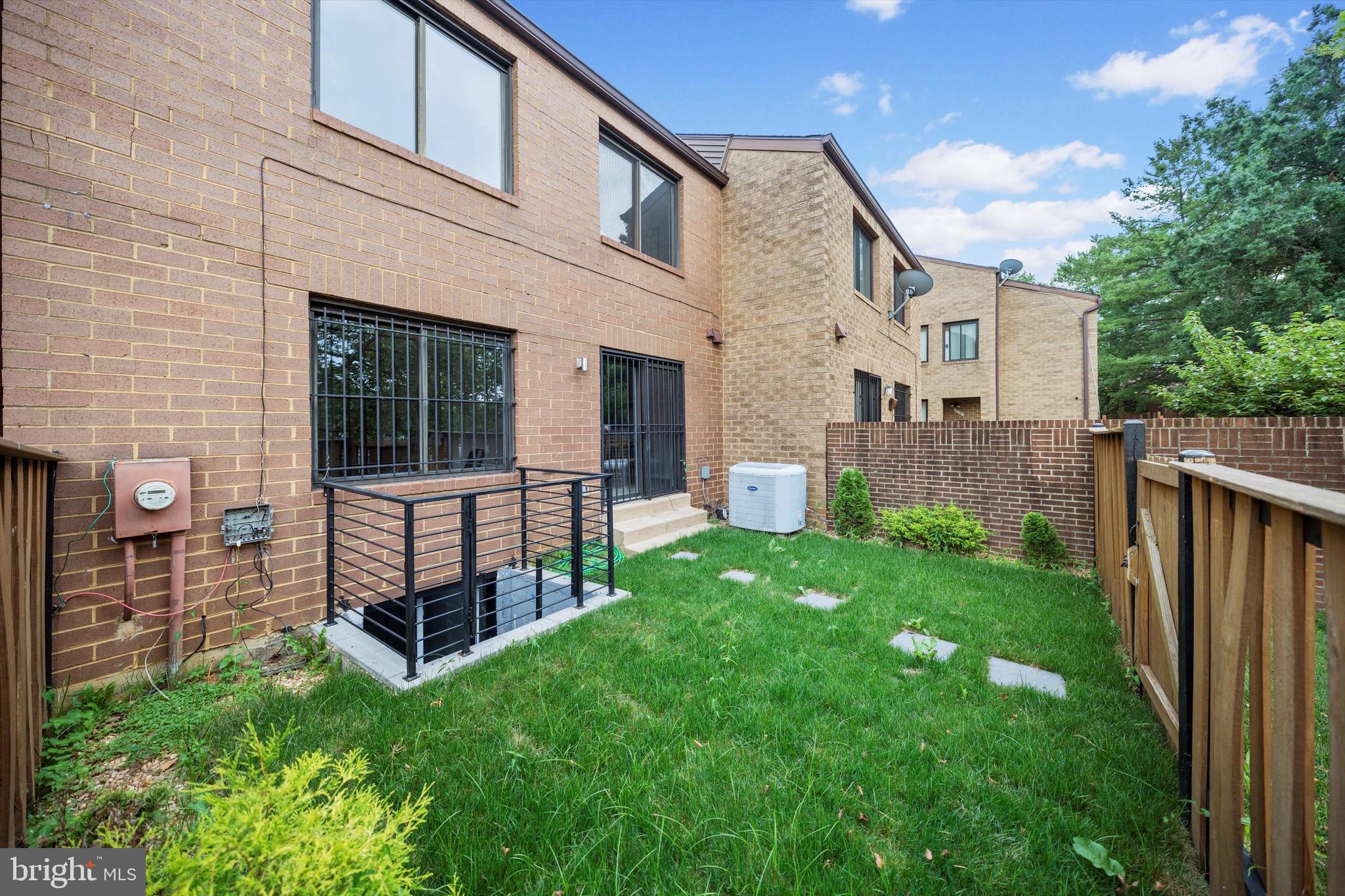 3114 Berry Road Northeast, Unit 21 Washington, DC 20018 - Photo 21 of 25 a view of a house with backyard and porch