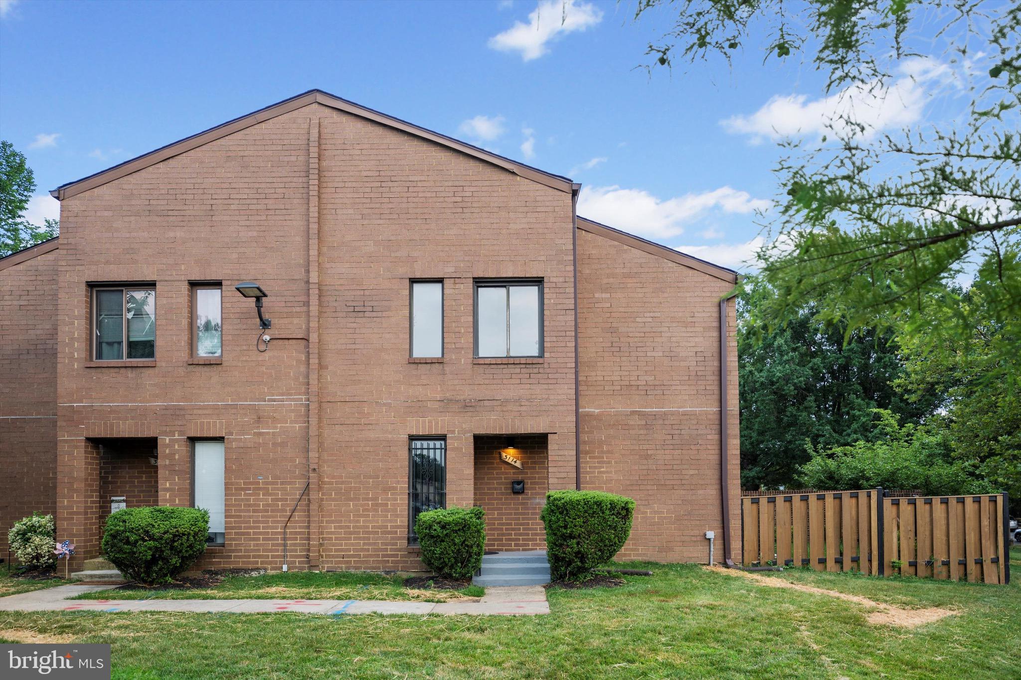 3114 Berry Road Northeast, Unit 21 Washington, DC 20018 - Photo 22 of 25 a front view of a house with garden