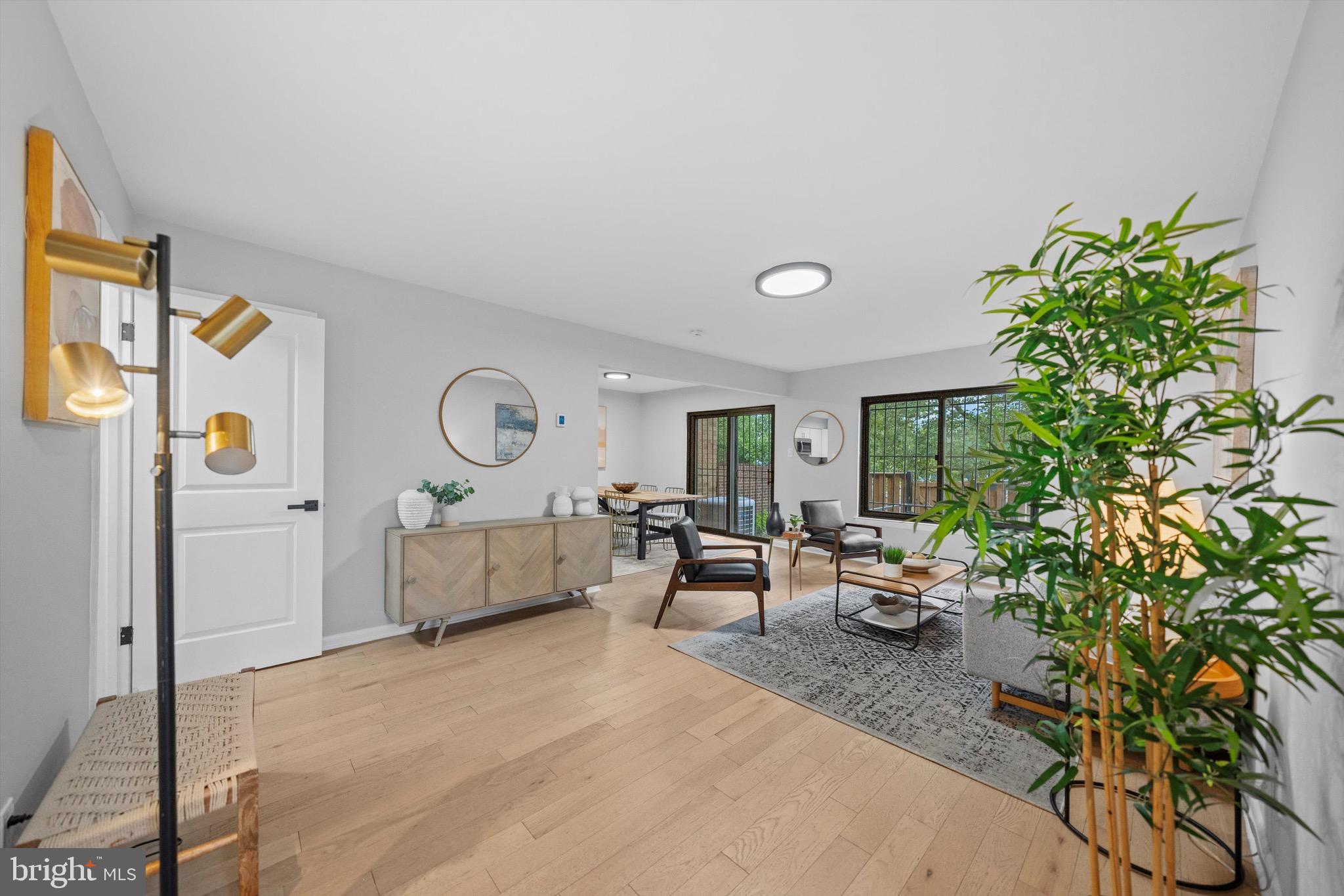 3114 Berry Road Northeast, Unit 21 Washington, DC 20018 - Photo 8 of 25 a living room with furniture and a potted plant